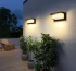 Modern outdoor wall lights (with anti-oxidation finish) illuminating a patio—resistant to scratches and rust.