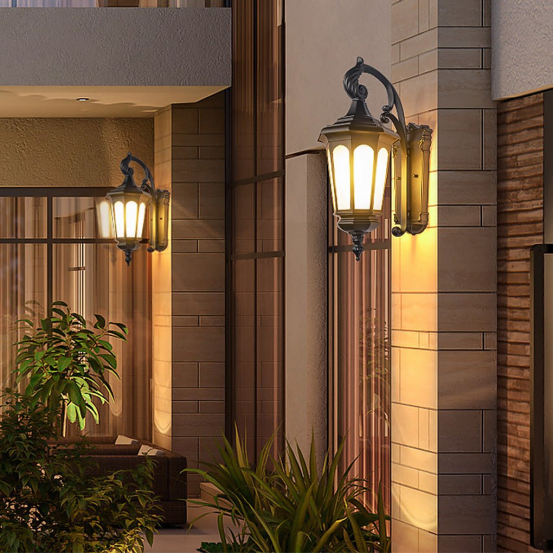 This outdoor wall light’s warm tone complements the stone siding, fitting the perfect color-match guide.