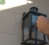 Installing a durable outdoor wall light with a motion sensor, a key upgrade for modern home security and convenience.