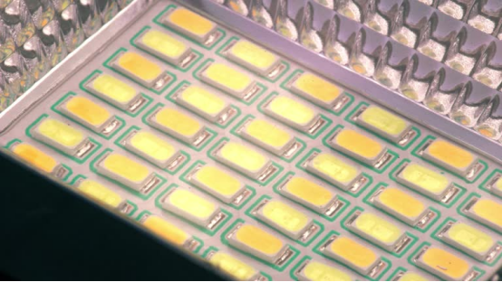 A close-up of an array of integrated LED chips on a circuit board, showcasing the core component that enables the long lifespan of modern outdoor wall lights.